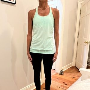 Lululemon tank top in size 6. Worn but good condition. Soft turquoise color.